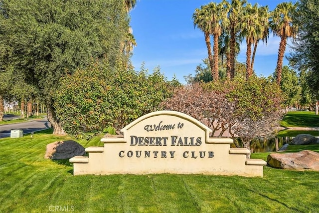 community / neighborhood sign featuring a yard