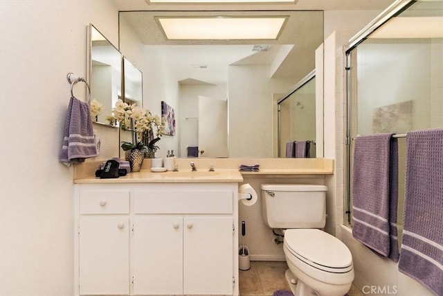 128 Desert Falls Dr E, Palm Desert, CA 92211 - full bath with an enclosed shower, toilet, tile patterned floors, and vanity