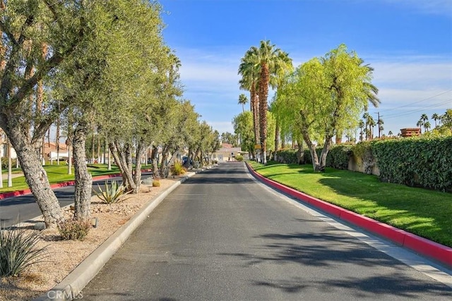 128 Desert Falls Dr E, Palm Desert, CA 92211 - view of asphalt road featuring curbs