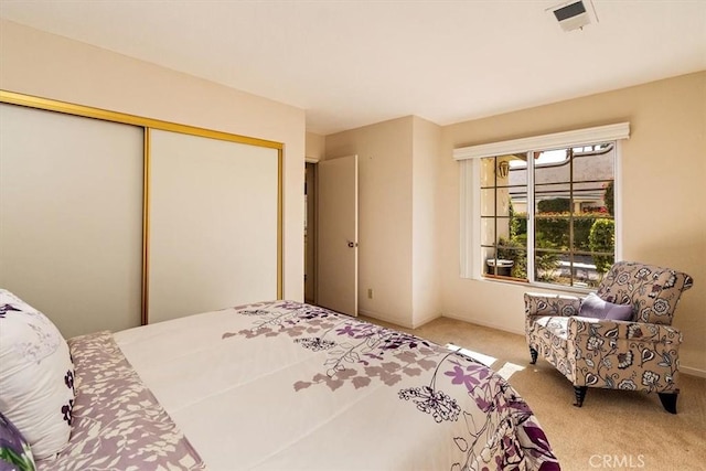 carpeted bedroom with a closet