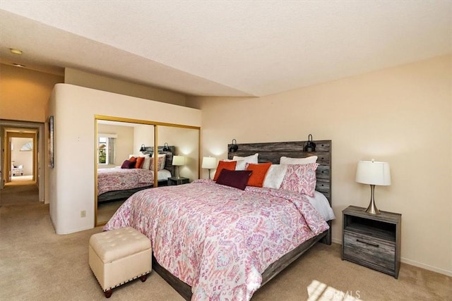 carpeted bedroom with a closet