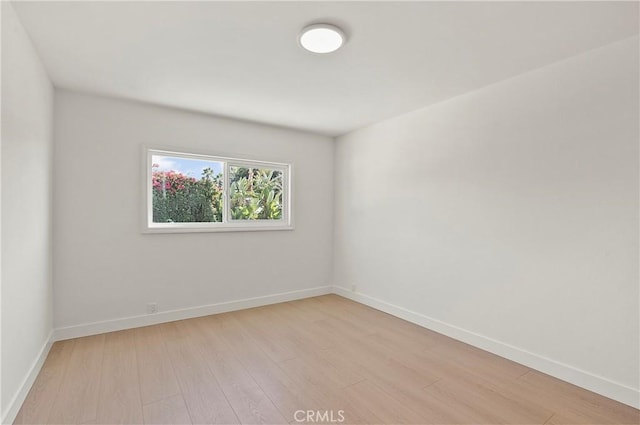 unfurnished room featuring light hardwood / wood-style flooring