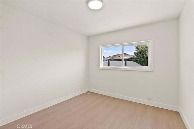 unfurnished room featuring light wood-type flooring