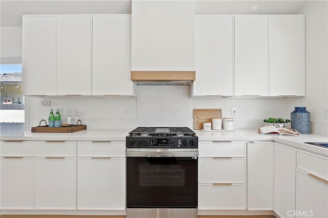 kitchen featuring white cabinets and stainless steel gas range