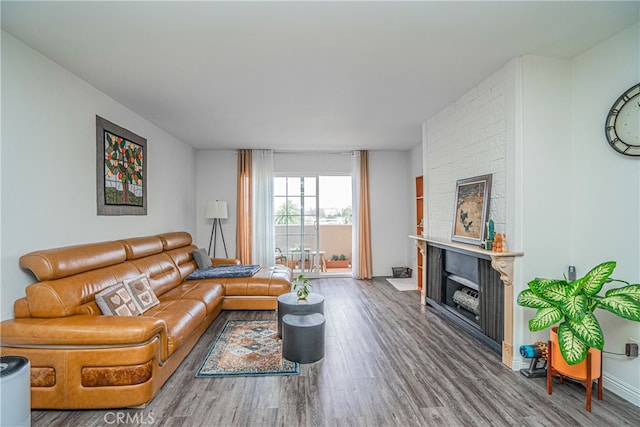 living room featuring a fireplace and hardwood / wood-style floors