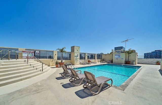 view of pool featuring a patio area