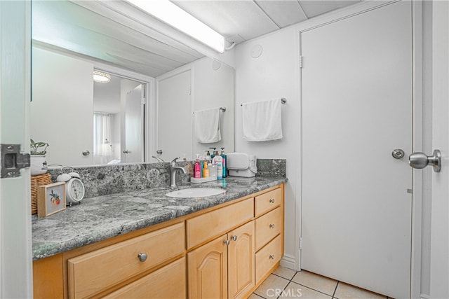 bathroom with vanity and tile patterned flooring