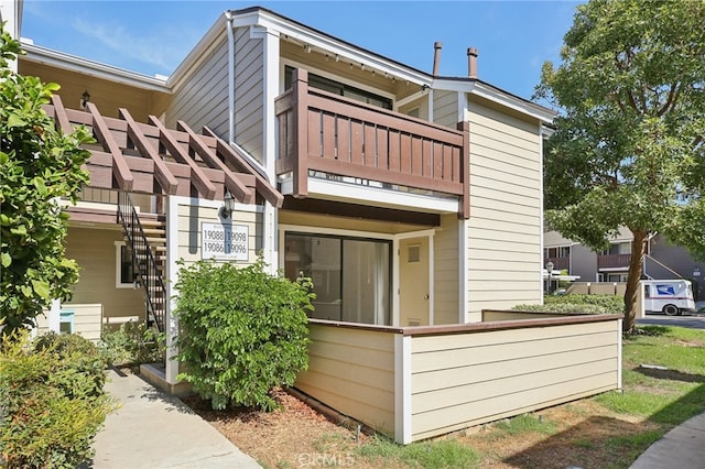 rear view of house with a balcony