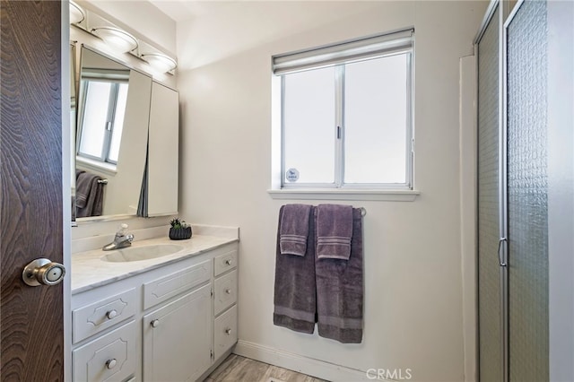 bathroom with wood-type flooring and vanity