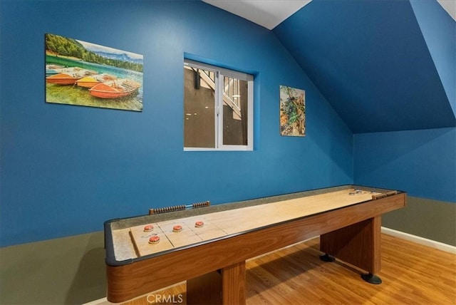 rec room with vaulted ceiling and hardwood / wood-style flooring