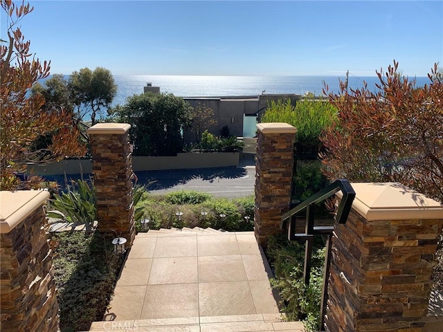 view of patio / terrace featuring a water view