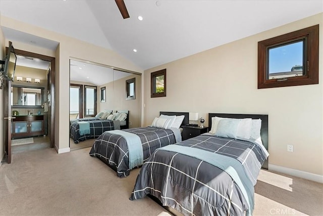 carpeted bedroom featuring lofted ceiling, a closet, and ceiling fan