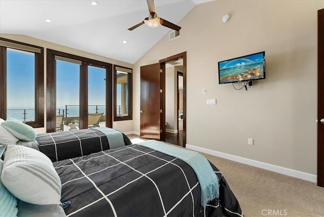 carpeted bedroom featuring ceiling fan and vaulted ceiling