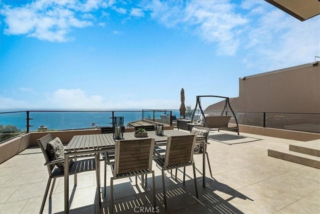 view of patio / terrace with a water view