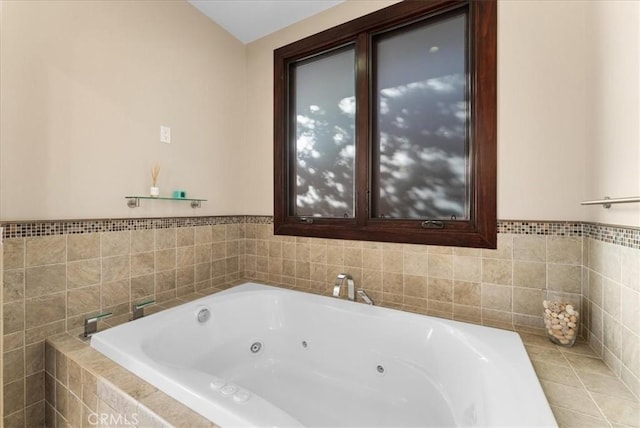 bathroom featuring tiled bath