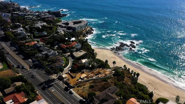 bird's eye view with a beach view and a water view