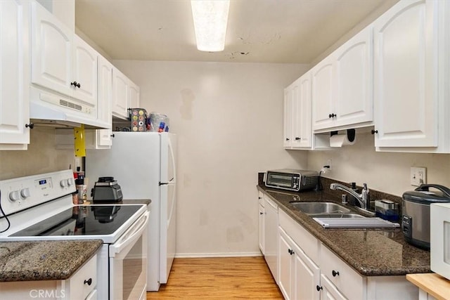 kitchen featuring white cabinetry, light hardwood / wood-style flooring, sink, dark stone counters, and white electric stove