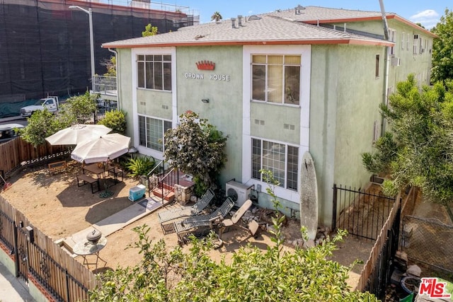 rear view of property featuring a patio area