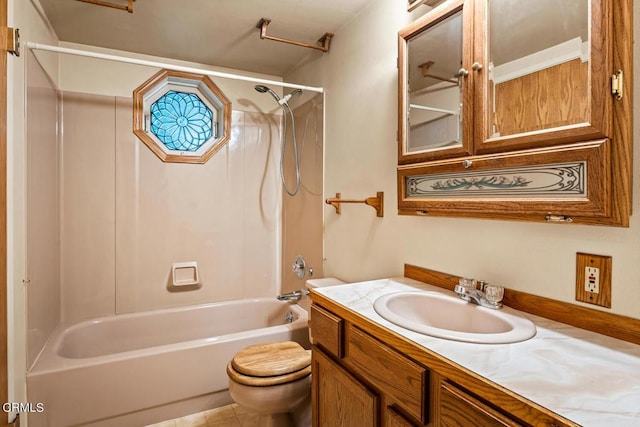 full bathroom featuring washtub / shower combination, tile patterned floors, vanity, and toilet