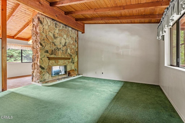 unfurnished living room featuring a fireplace, vaulted ceiling with beams, wooden ceiling, and carpet flooring