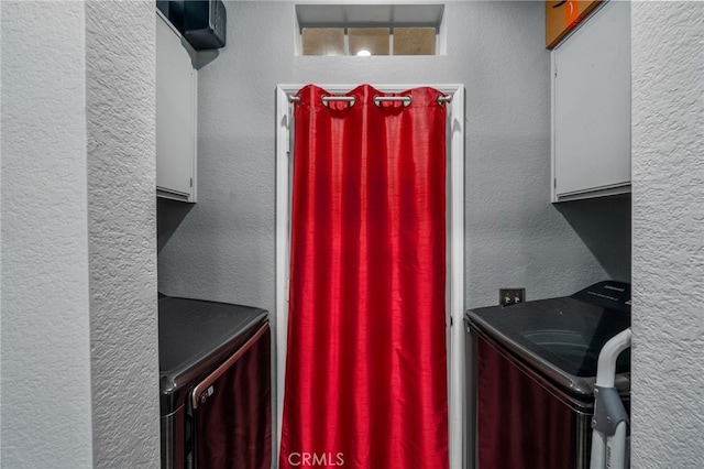 clothes washing area featuring washer / clothes dryer