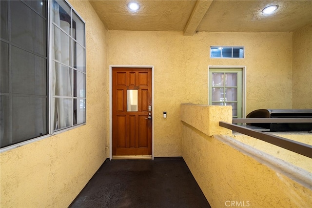 property entrance with a balcony