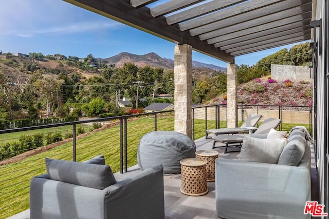 view of patio featuring an outdoor living space, a mountain view, and a pergola