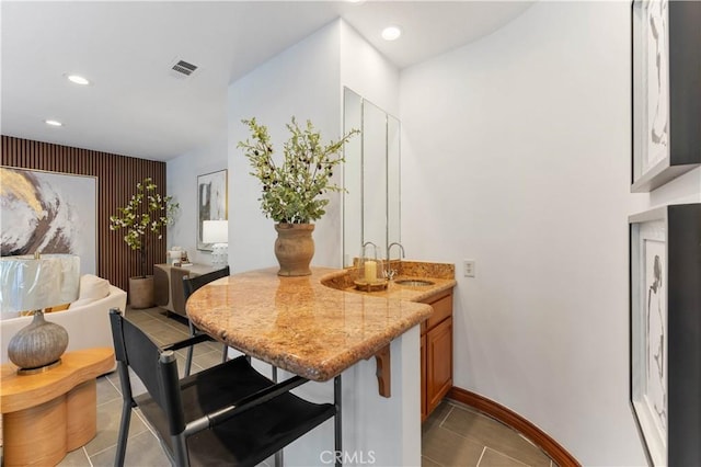 tiled dining room with sink