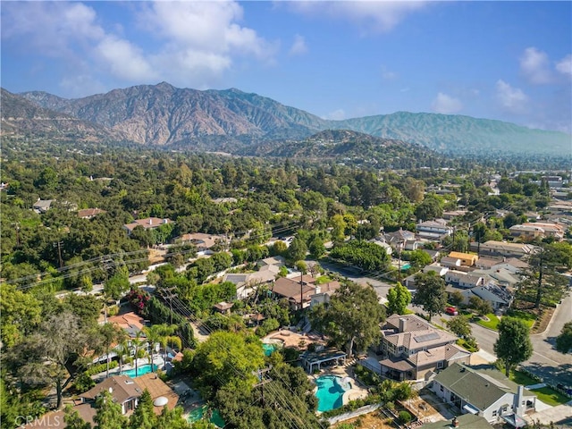 birds eye view of property with a mountain view