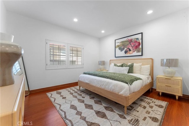 bedroom with hardwood / wood-style floors