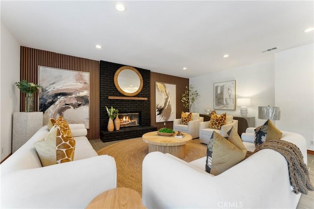 tiled living room featuring a fireplace