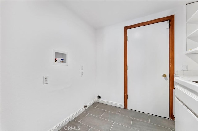 washroom featuring hookup for a washing machine, tile patterned flooring, and hookup for a gas dryer