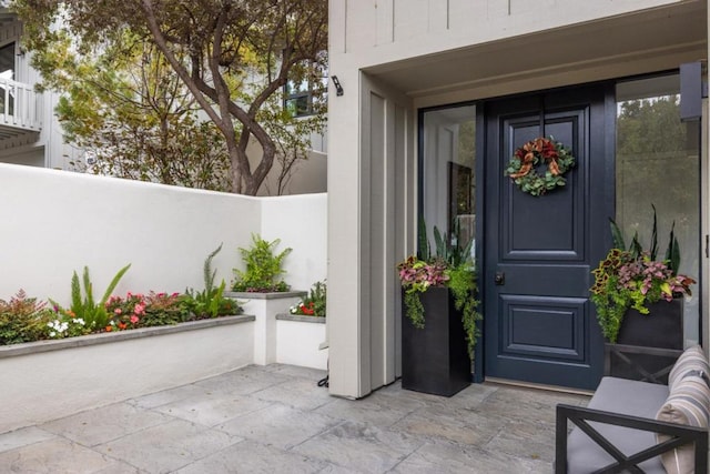 doorway to property with a patio area