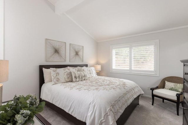 carpeted bedroom with lofted ceiling with beams