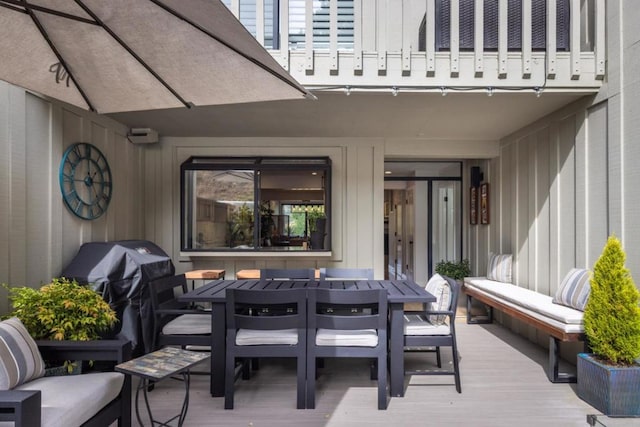 view of patio featuring a balcony, a wooden deck, and area for grilling