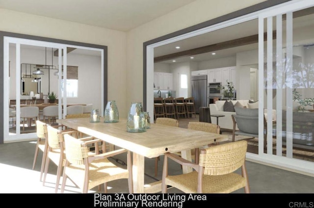 dining space featuring concrete flooring