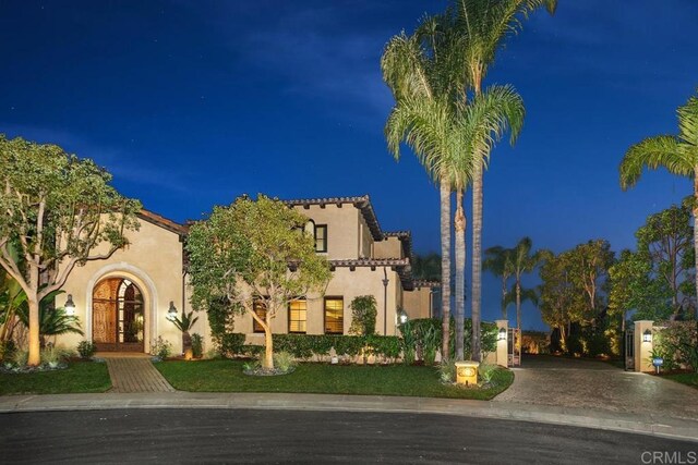 mediterranean / spanish-style home featuring french doors