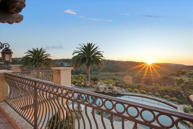 view of balcony at dusk