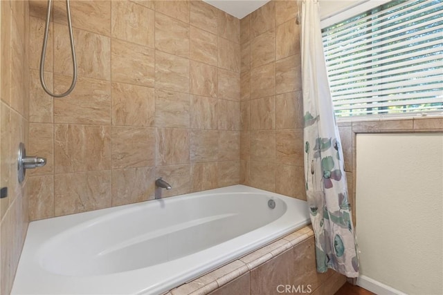 bathroom with shower / bathtub combination with curtain