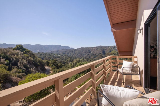 balcony featuring a mountain view