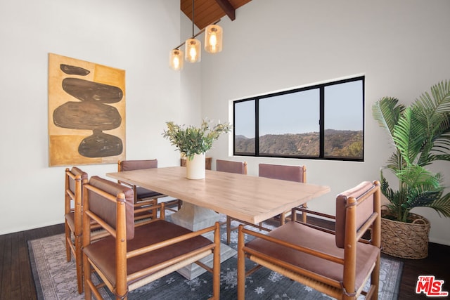 dining room with high vaulted ceiling, dark hardwood / wood-style floors, wood ceiling, and beamed ceiling