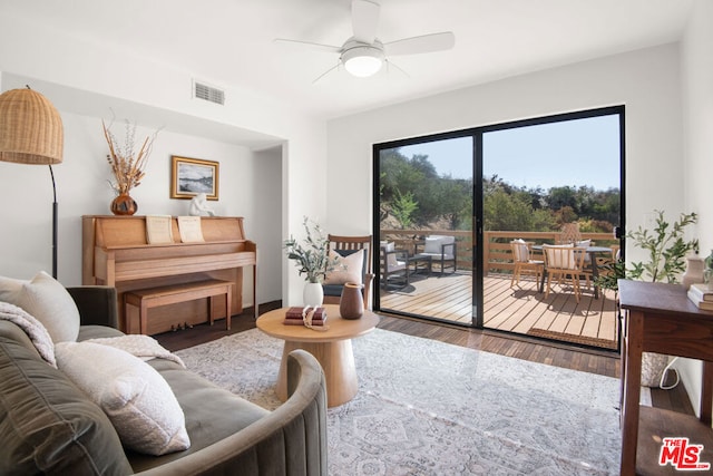 living room with ceiling fan and hardwood / wood-style flooring