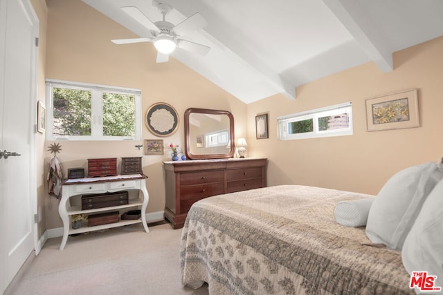 carpeted bedroom with ceiling fan and vaulted ceiling with beams