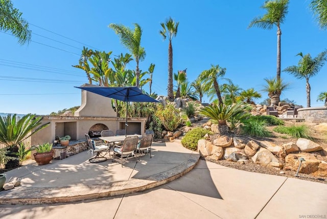 view of patio featuring exterior fireplace