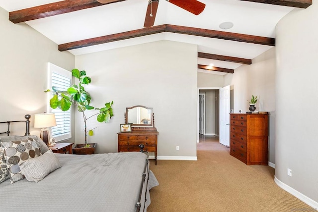 carpeted bedroom with vaulted ceiling with beams and ceiling fan