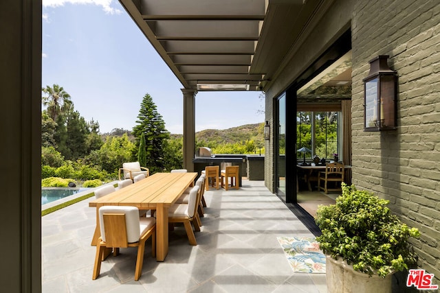 view of patio / terrace with a mountain view