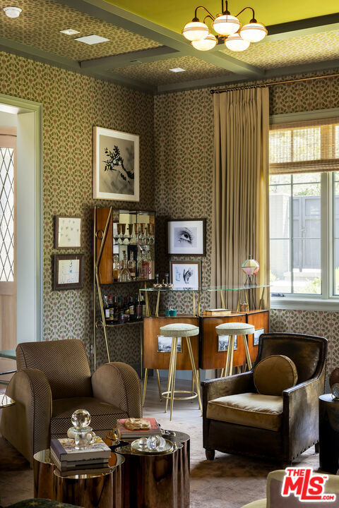 living area featuring an inviting chandelier