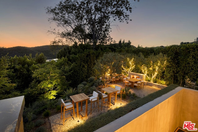 view of patio terrace at dusk