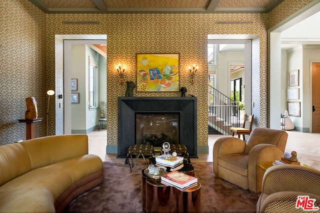 sitting room featuring a fireplace, beam ceiling, and ornamental molding