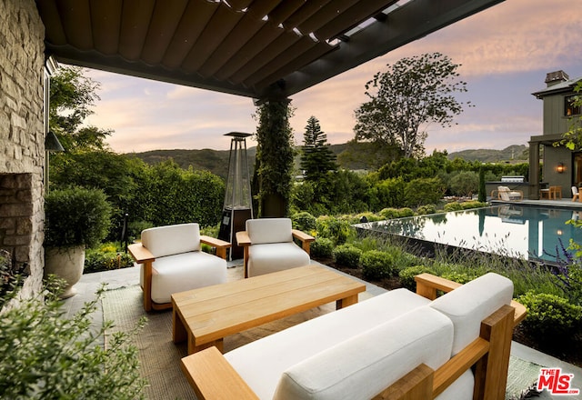 view of patio terrace at dusk